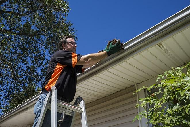 rusted rain gutter undergoing repair in Capistrano Beach